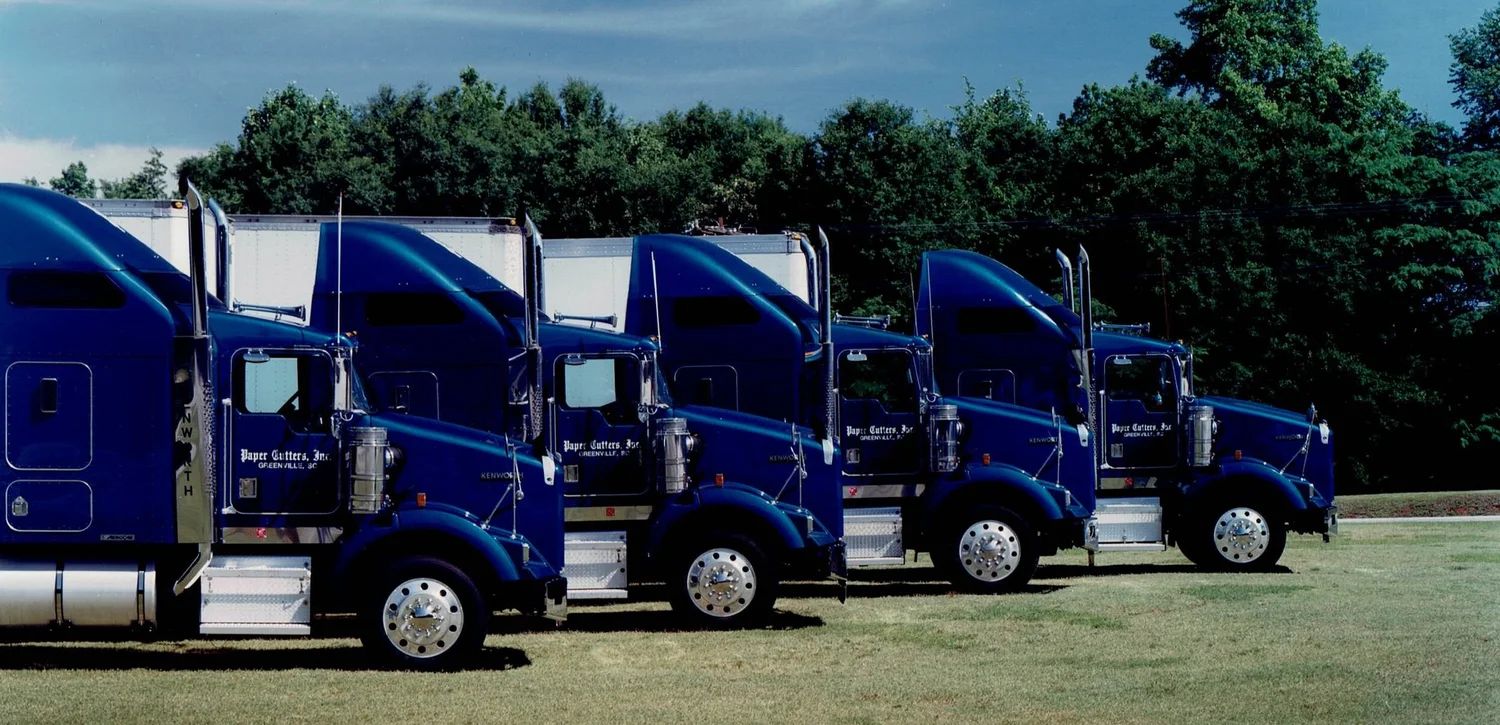 Paper Cutters trucks lined up at the Greenville plant